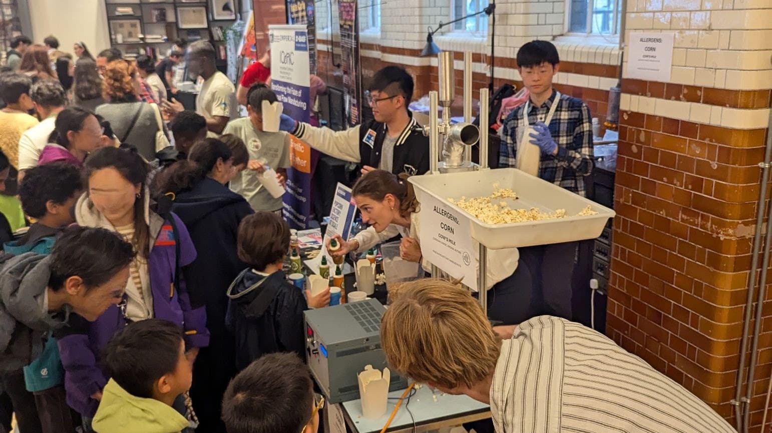 A crowd gathered around the TurboPop prototype serving popcorn at the Great Exhibition Road Festival
